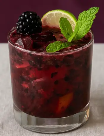 Non Alcoholic Blackberry Mojito Mocktail Recipe Non-alcoholic blackberry mojito mocktail recipe with fresh blackberries, mint leaves, and lime garnish.