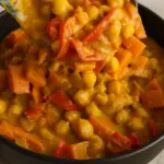 Coconut chickpea curry with carrots and red peppers in a creamy golden sauce.