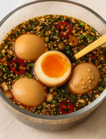 Easy Mayak Eggs (Korean Marinated Eggs Recipe) Korean marinated eggs recipe featuring soft-boiled mayak eggs soaked in soy sauce with sesame seeds, scallions, and chili slices for a high protein snack or breakfast.