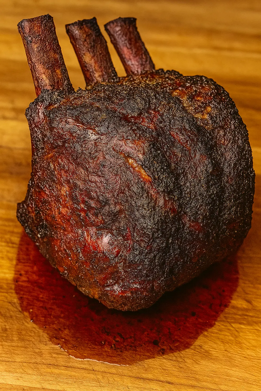 Traeger Smoked Prime Rib Recipe Smoked prime rib roast with a beautiful smoky bark and juicy medium-rare center, a mouthwatering main course ideal for festive holiday celebrations.